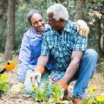 two seniors in their garden